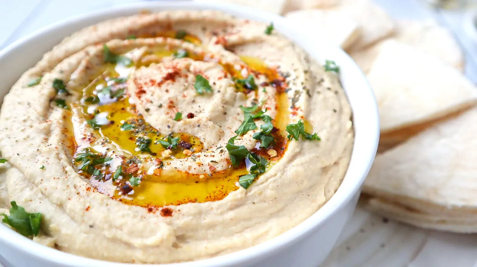 Incredibly delicious with just: chickpeas, tahini, lemon, garlic, salt, ice water