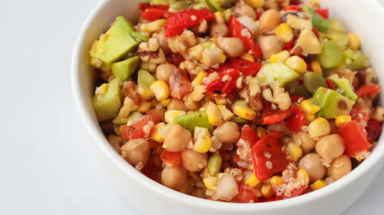 The most important ingredients in this Mexican-style salad are corn, peppers, chickpeas, and avocado