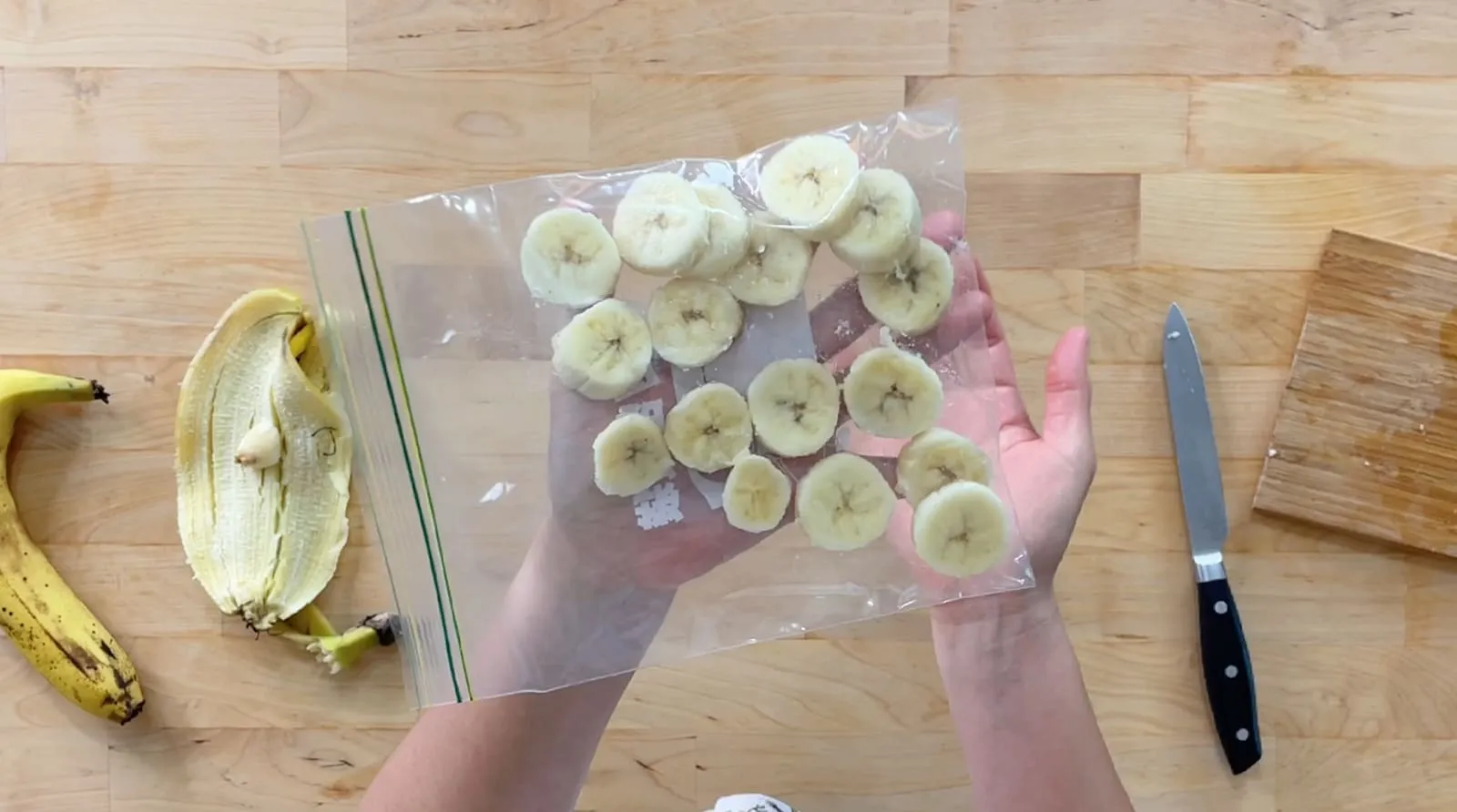 How to fast-freeze bananas: put the banana slices in a zip-top bag, spread each slice out flat, and lay the bag flat in the freezer for 2 hours.