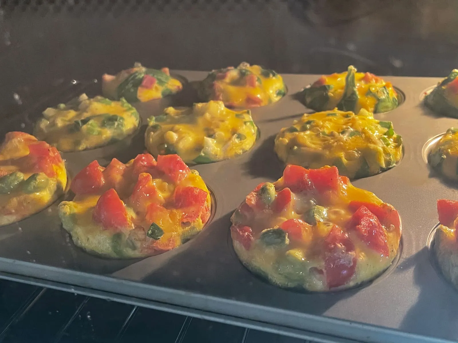 Fill the cups only 70-80% full with egg, because the eggs puff up as they bake. It's normal for the egg muffins to shrink a little after baking.